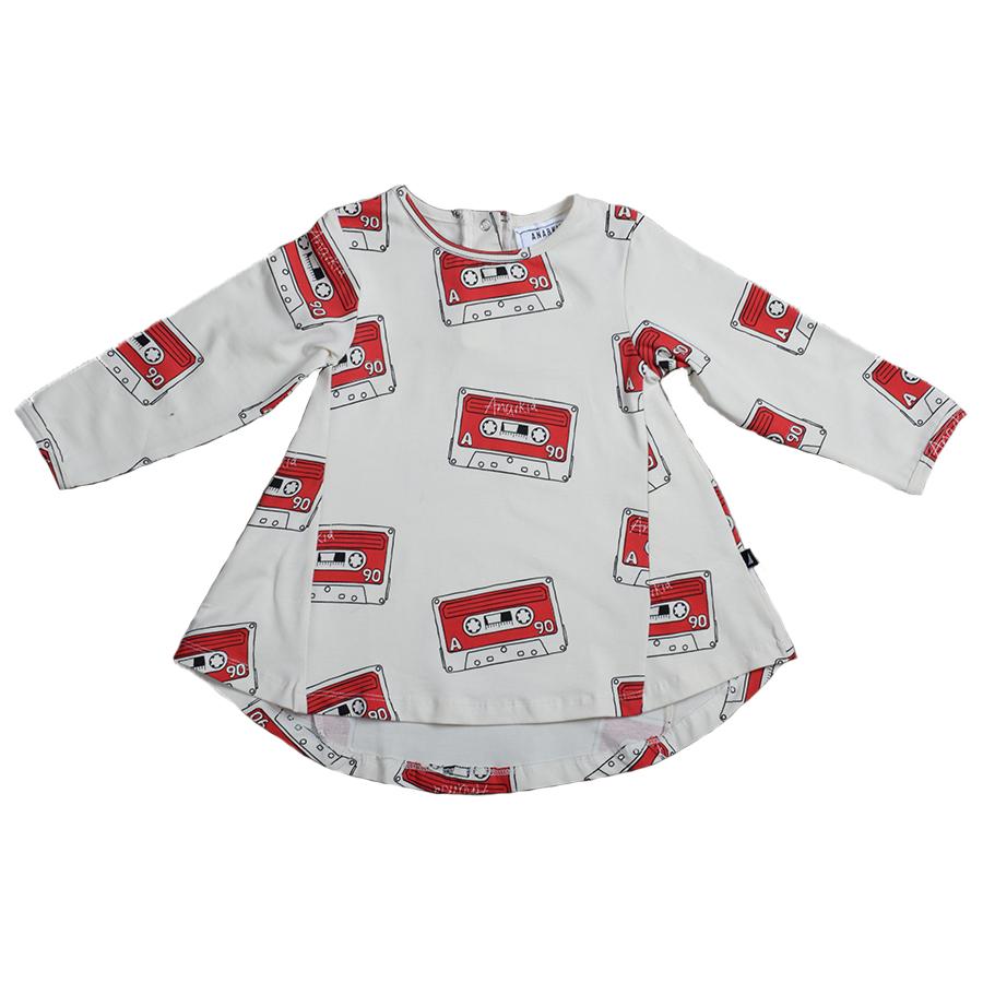 An Anarkid Organic Cotton Mix Tape Swing Dress - LUCKY LAST - 3-6 MONTHS ONLY, featuring a mix tape design with red and white tapes on a white dress.