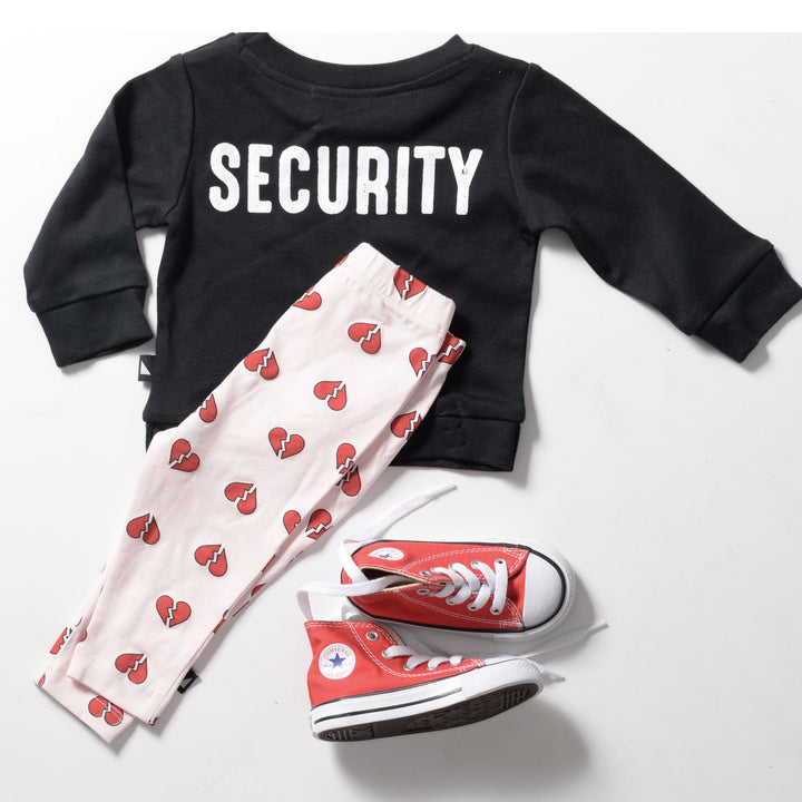 A high quality Anarkid black sweatshirt with the words security and a pair of Anarkid Organic Cotton Pink Heartbreaker Leggings - LUCKY LAST - 0-3 MONTHS converse shoes.