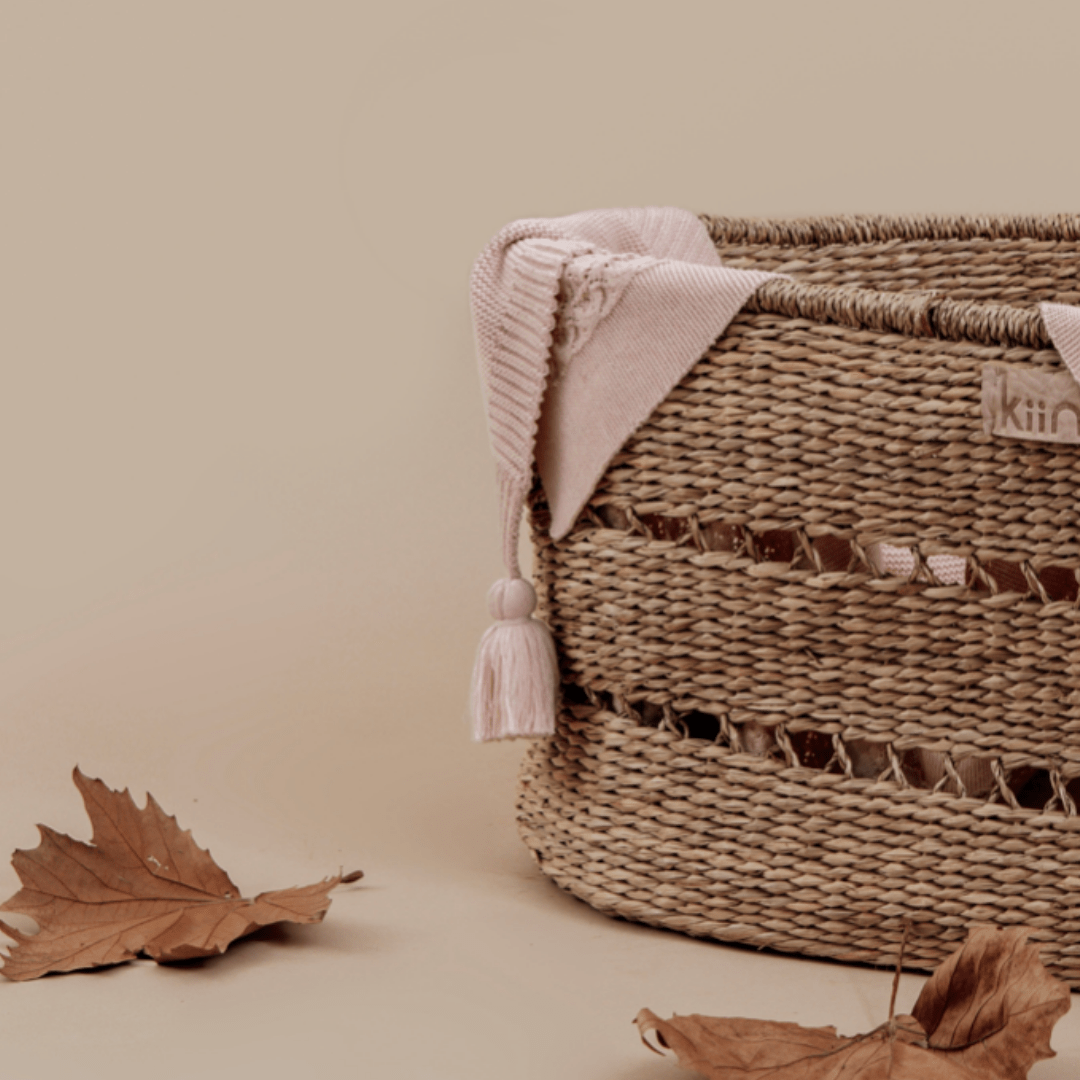 Aster-And-Oak-Organic-Chunky-Knit-Blanket-Pink-Draped-Over-Basket-Naked-Baby-Eco-Boutique