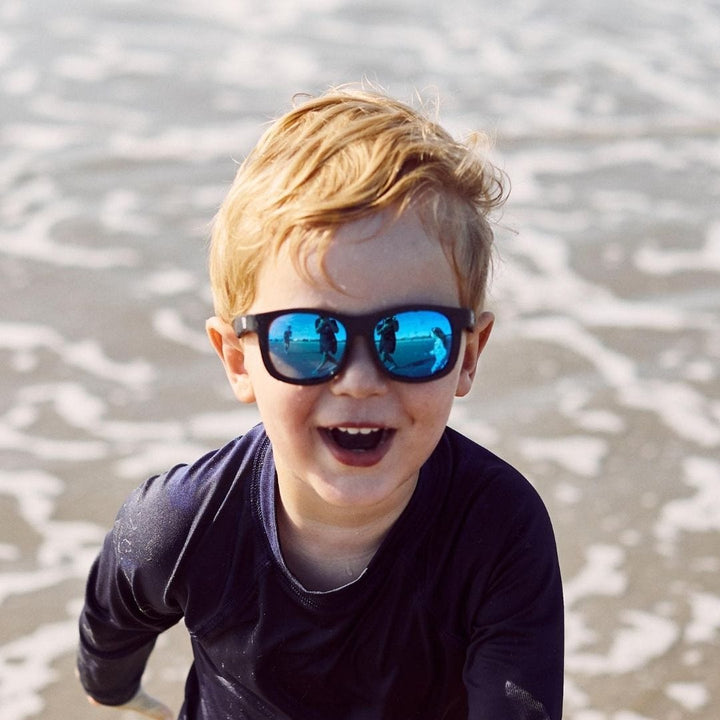 Little-Boy-Laughing-Wearing-Babiators-Polarized-Navigators-Baby-Kids-Sunglasses-The-Scout-Naked-Baby-Eco-Boutique