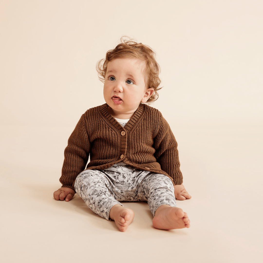 Baby-Boy-Sitting-Wearing-Wilson-and-Frenchy-Knitted-Button-Cardigan-Dijon-Naked-Baby-Eco-Boutique