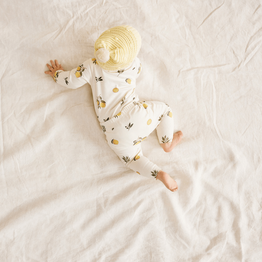 Baby-Crawling-Wearing-Wilson-and-Frenchy-Organic-Cotton-Envelope-Onesie-Lovely-Lemons-Naked-Baby-Eco-Boutique