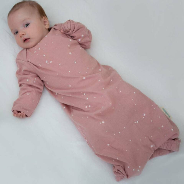Baby-Lying-on-Back-Wearing-Woolbabe-Merino-and-Organic-Cotton-Sleeping-Gown-Dusk-Stars-Naked-Baby-Eco-Boutique