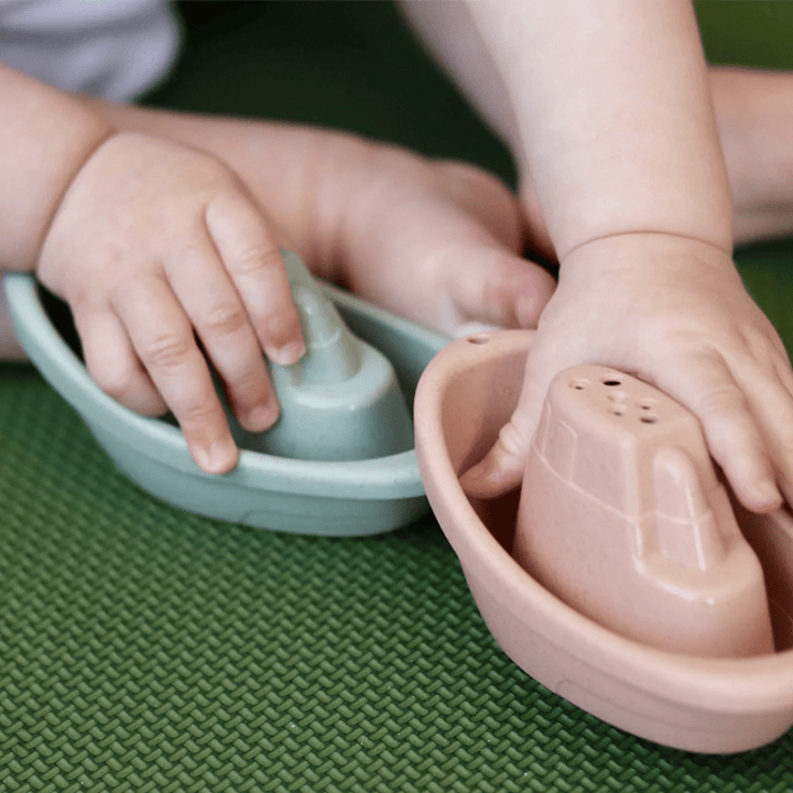 Baby-Playing-With-Two-New-Edition-Biodegradable-Wheat-Straw-Bath-Boats-Naked-Baby-Eco-Boutique