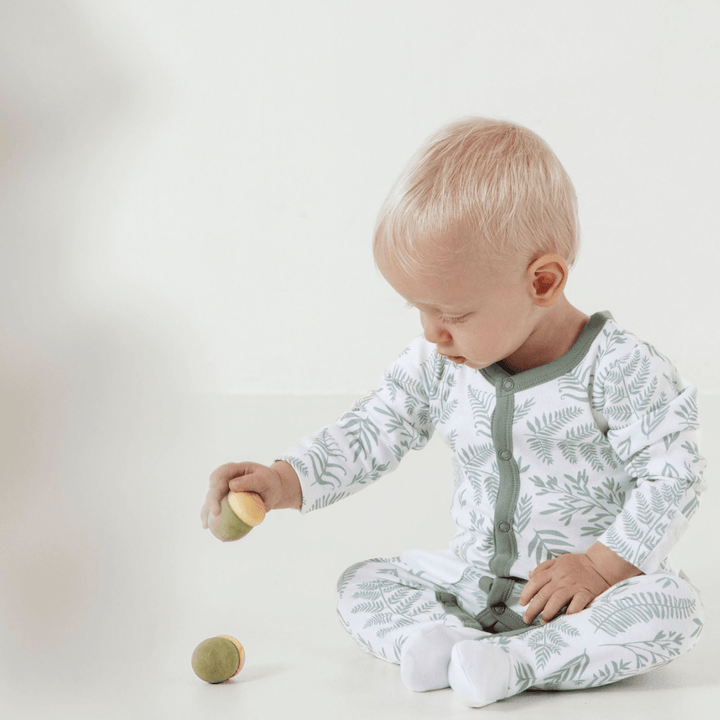 Baby-Sitting-Wearing-Aster-and-Oak-Organic-Cotton-Baby-Pyjamas-Fern-Naked-Baby-Eco-Boutique