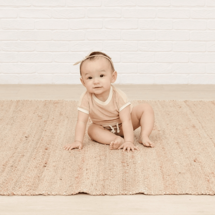 Baby-Sitting-Wearing-Quincy-Mae-Organic-Terry-Retro-Romper-Blush-Naked-Baby-Eco-Boutique