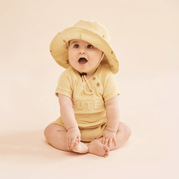 Baby-Sitting-Wearing-Sunhat-and-Baby-Wearing-Sunhat-and-Wilson-and-Frenchy-Organic-Terry-Tie-Front-Shorts-Prickle-Naked-Baby-Eco-Boutique