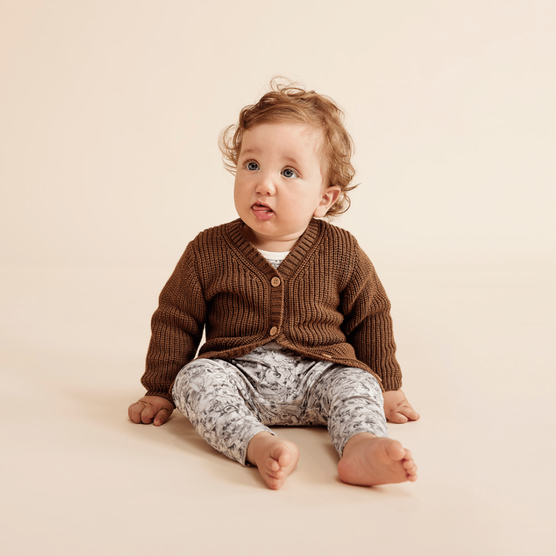 Baby-Sitting-Wearing-Wilson-and-Frenchy-Organic-Cotton-Envelope-Onesie-Forest-Animals-Under-Cardigan-Naked-Baby-Eco-Boutique