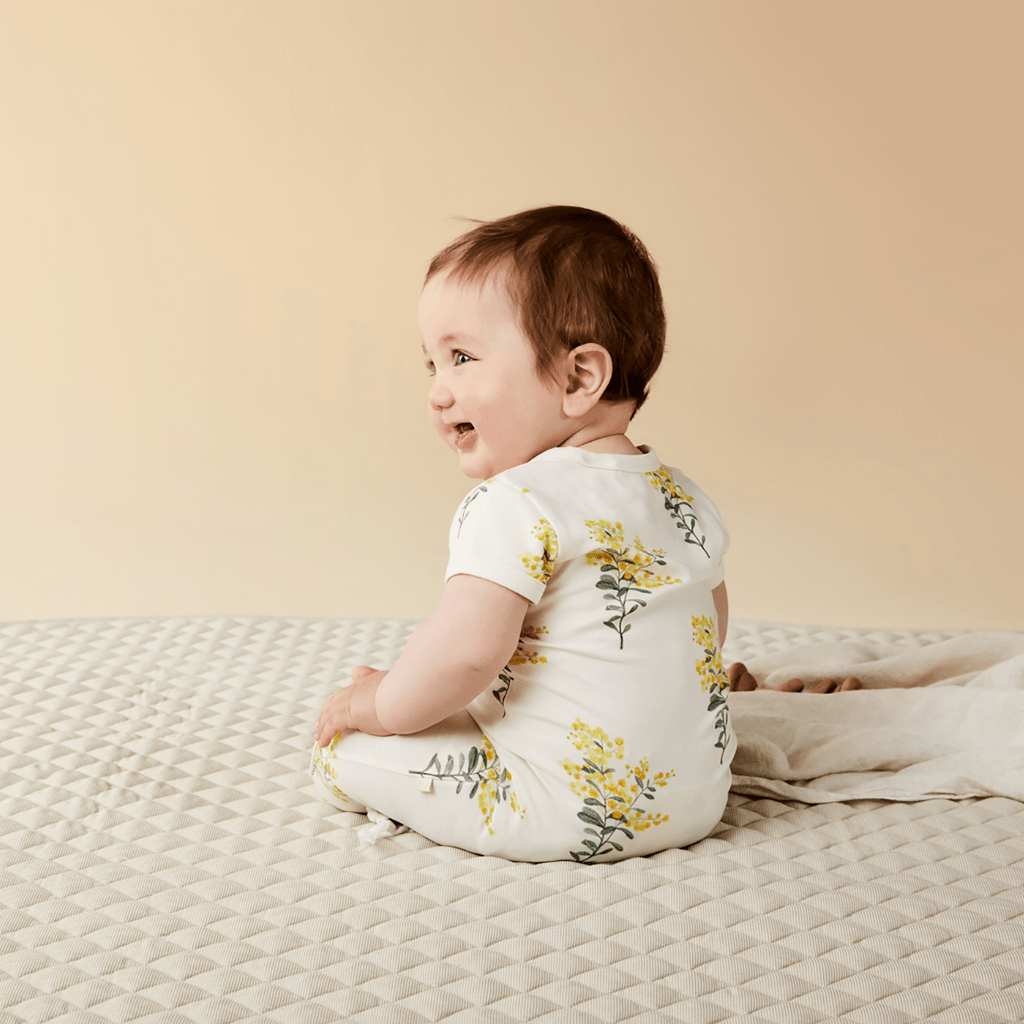 Baby-Smiling-Wearing-Wilson-and-Frenchy-Organic-Zipsuit-Naked-Baby-Eco-Boutique