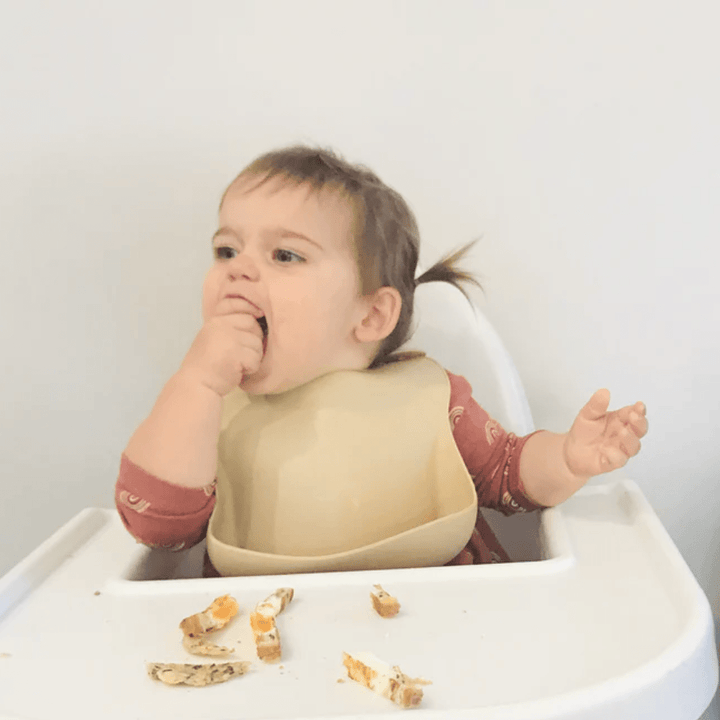 Baby-Wearing-Petite-Eats-Large-Silicone-Baby-Bib-Dusty-Coral-Naked-Baby-Eco-Boutique