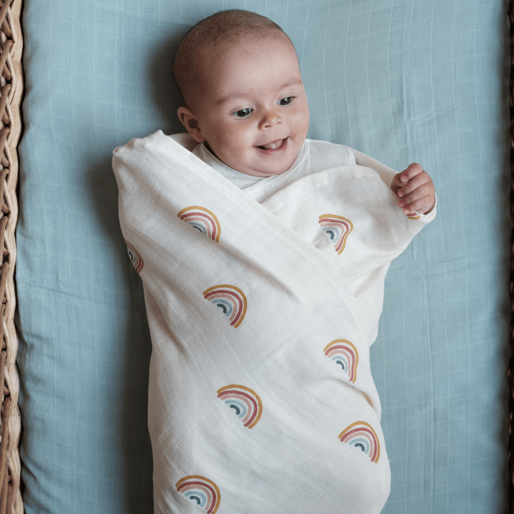 Baby-Wrapped-in-Fabelab-Organic-Cotton-Swaddle-Blanket-Rainbows-Naked-Baby-Eco-Boutique.png