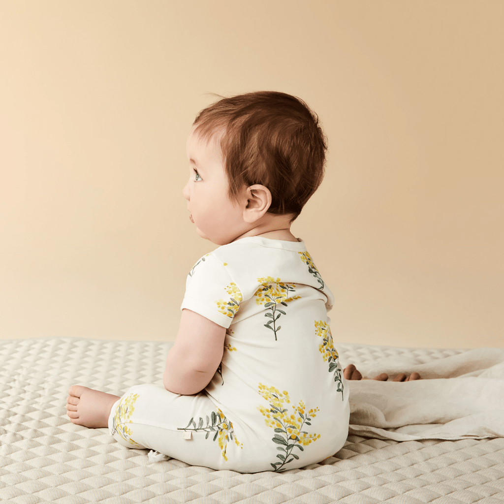 Back-View-of-Baby-Wearing-Wilson-and-Frenchy-Organic-Zipsuit-Little-Blossom-Naked-Baby-Eco-Boutique