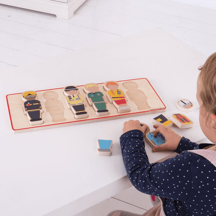 Bigjigs-The-People-Who-Help-Us-Wooden-Puzzle-Little-Baby-Playing-With-Puzzle-Pieces-Naked-Baby-Eco-Boutique