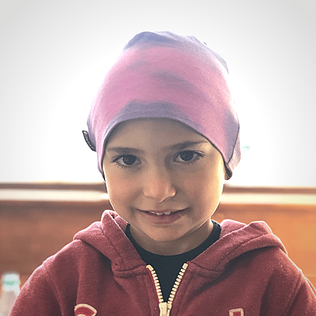 A young girl wearing an Anarkid Magic Colour-Change Beanie (Multiple Variants).
