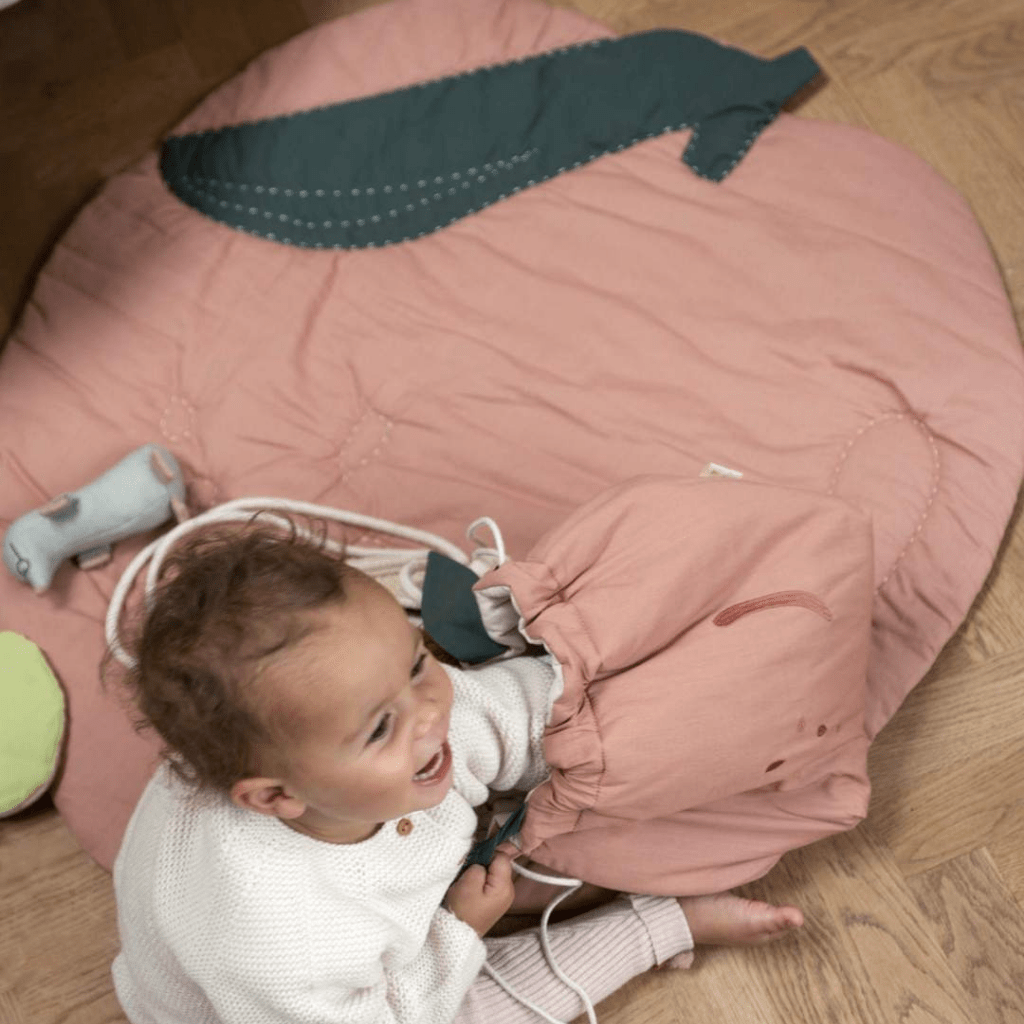 Child-Playing-on-Fabelab-Organic-Cotton-Quilted-Baby-Blanket-Peach-Naked-Baby-Eco-Boutique