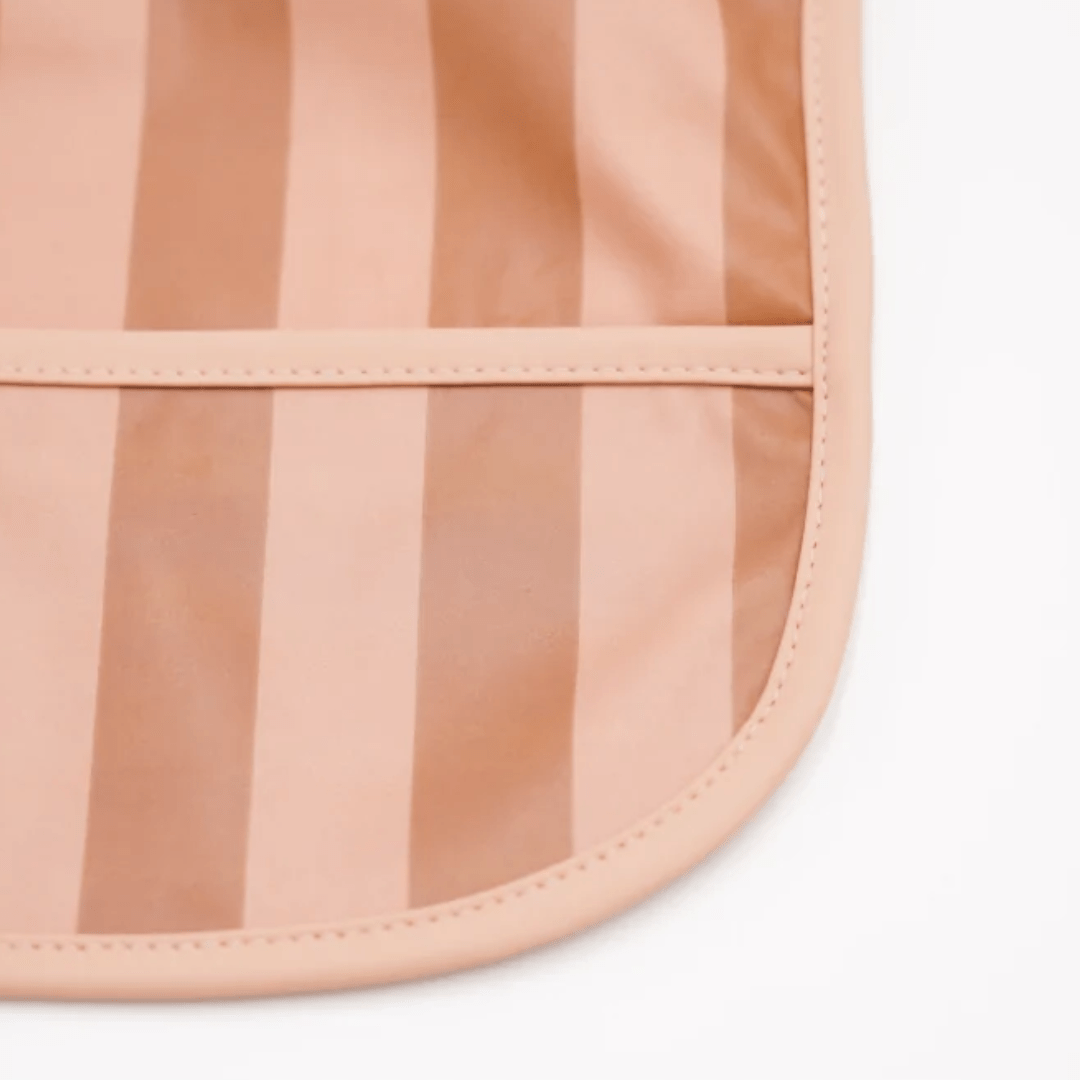 Close-Up-Of-Grech-And-Co-Recycled-Smock-Bib-Stripes-Sunset-And-Tierra-Naked-Baby-Eco-Boutique