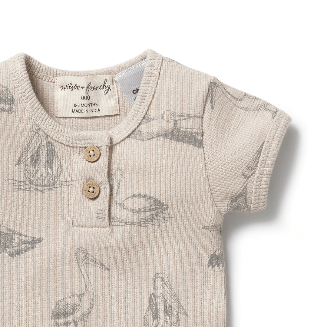 Close-Up-Of-Wilson-And-Frenchy-Organic-Rib-Henley-Onesie-Little-Pelican-Naked-Baby-Eco-Boutique