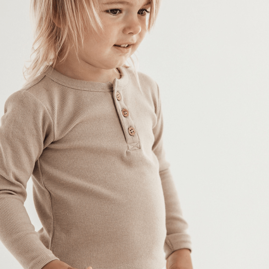 Close-up-Child-Wearing-Aster-and-Oak-Organic-Rib-Henley-Top-Hazelnut-Naked-Baby-Eco-Boutique