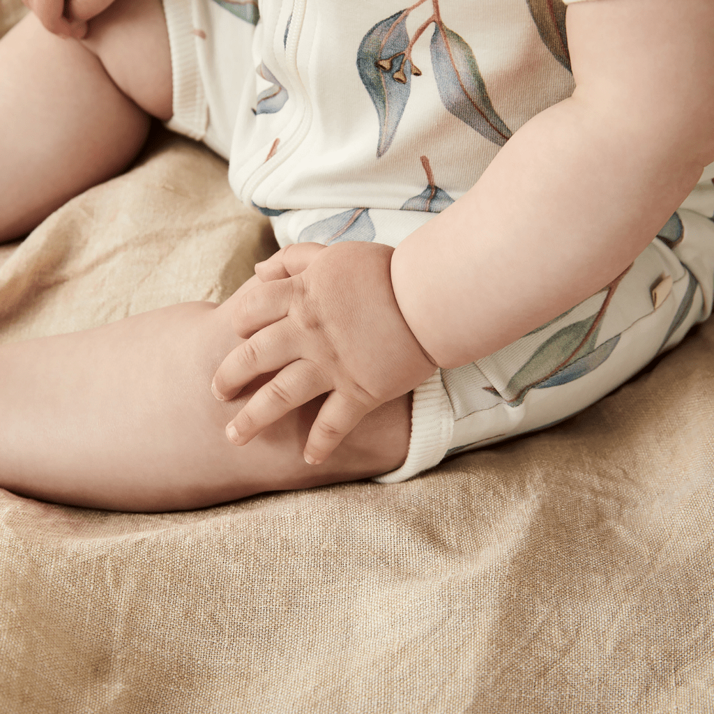 Close-up-of-Baby-Wearing-Wilson-and-Frenchy-Organic-Boyleg-Zipsuit-Blue-Eucalyptus-Naked-Baby-Eco-Boutique