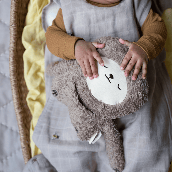Close-up-of-Baby-in-Basket-Wearin-Fabelab-Organic-Muslin-Sleeping-Bag-Naked-Baby-Eco-Boutique