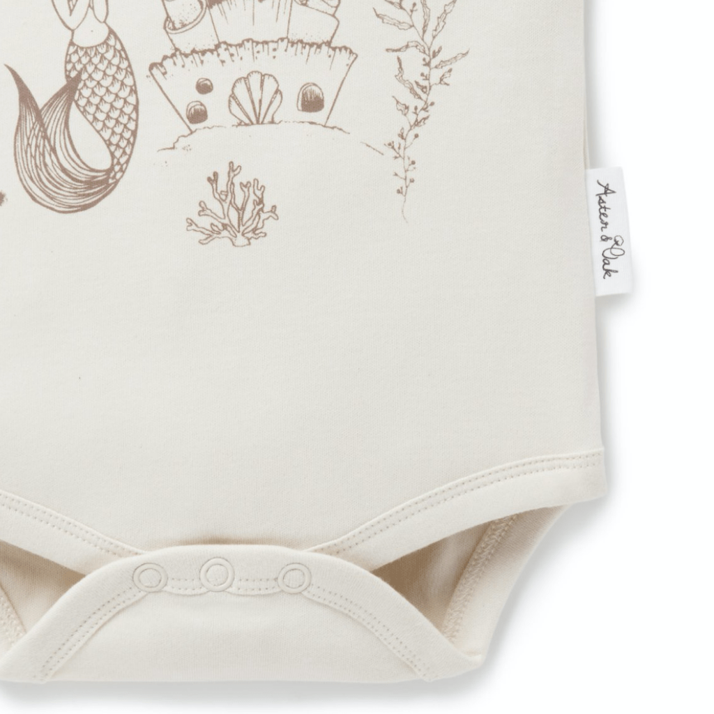 Close-up-of-Bottom-of-Aster-and-Oak-Organic-Mermaid-Flutter-Onesie-Naked-Baby-Eco-Boutique