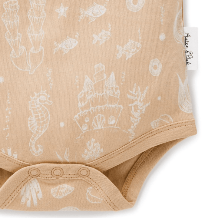 Close-up-of-Bottom-of-Aster-and-Oak-Organic-Mermaid-Lace-Henley-Onesie-Naked-Baby-Eco-Boutique