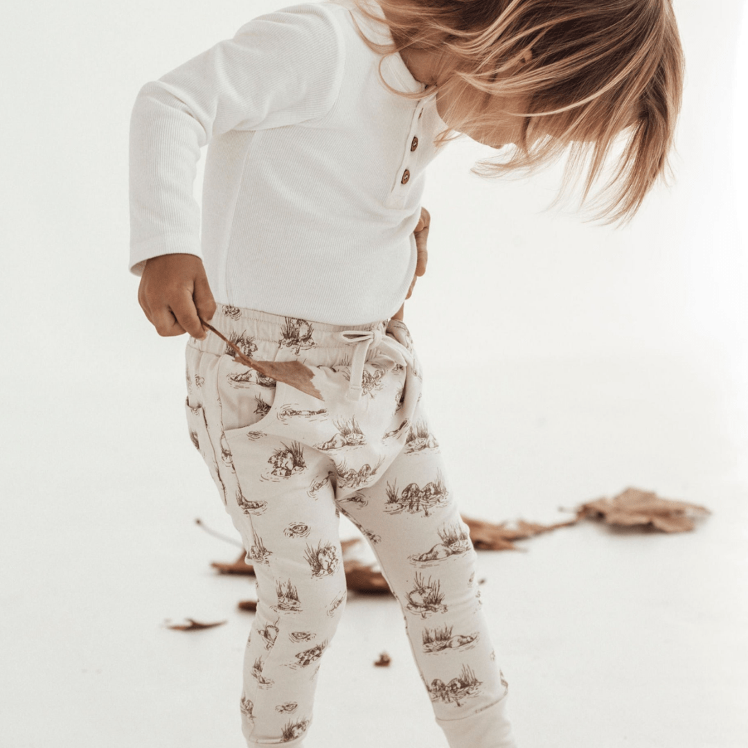 Close-up-of-Child-Wearing-Aster-and-Oak-Organic-Cotton-Harem-Pants-Beaver-Naked-Baby-Eco-Boutique