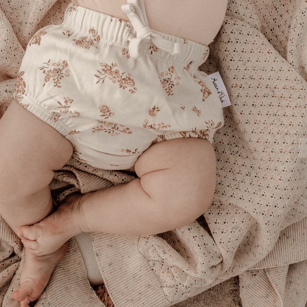 Close-up-of-Cute-Baby-Wearing-Aster-and-Oak-Organic-Posy-Floral-Bloomers-Naked-Baby-Eco-Boutique