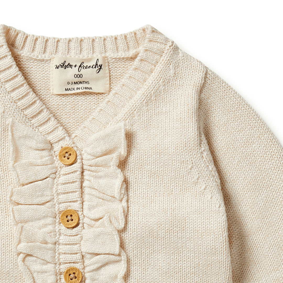 Close-up-of-Ruffle-and-Buttons-of-Wilson-and-Frenchy-Knitted-Ruffle-Cardigan-Sand-Melange-Naked-Baby-Eco-Boutique