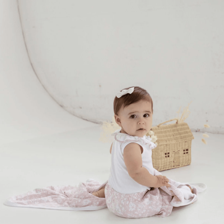 Cute-Baby-Looking-Over-Shoulder-Wearing-Aster-and-Oak-Organic-Ruffle-Bloomers-Naked-Baby-Eco-Boutique