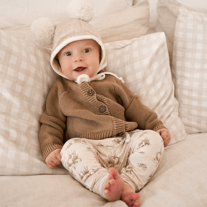 Cute-Baby-Sitting-Smiling-Wearing-Aster-and-Oak-Organic-Cotton-Harem-Pants-Beaver-Naked-Baby-Eco-Boutique