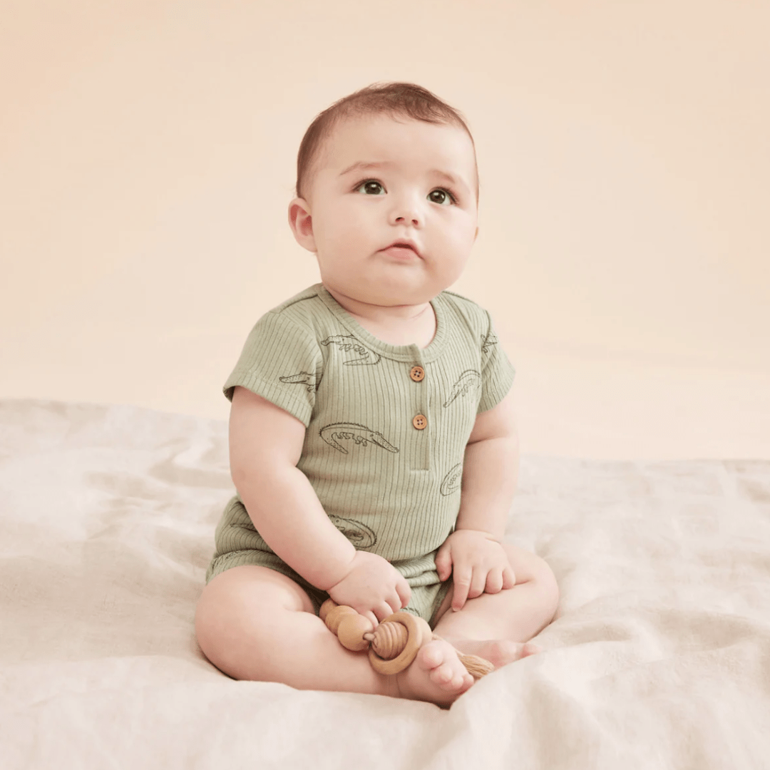 Cute-Baby-Sitting-Wearing-Wilson-and-Frenchy-Organic-Rib-Henley-Tee-Little-Croc-Naked-Baby-Eco-Boutique