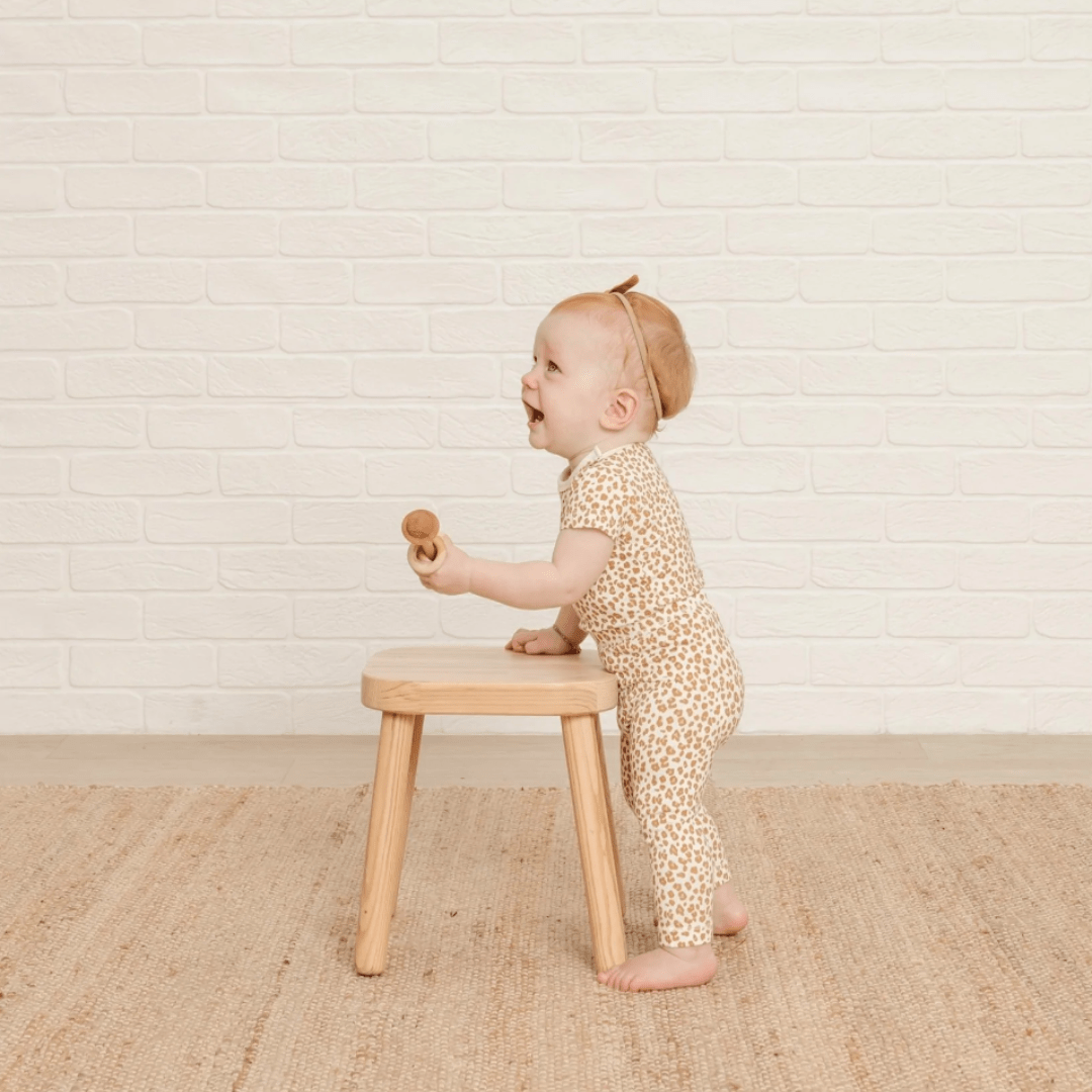 Cute-Baby-Standing-Laughing-Wearing-Quincy-Mae-Bamboo-Leggings-Cheetah-Naked-Baby-Eco-Boutique