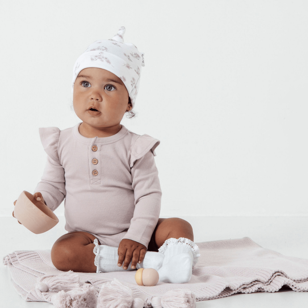 Cute-Baby-Witting-Wearing-Aster-and-Oak-Organic-Rib-Onesie-Violet-Naked-Baby-Eco-Boutique