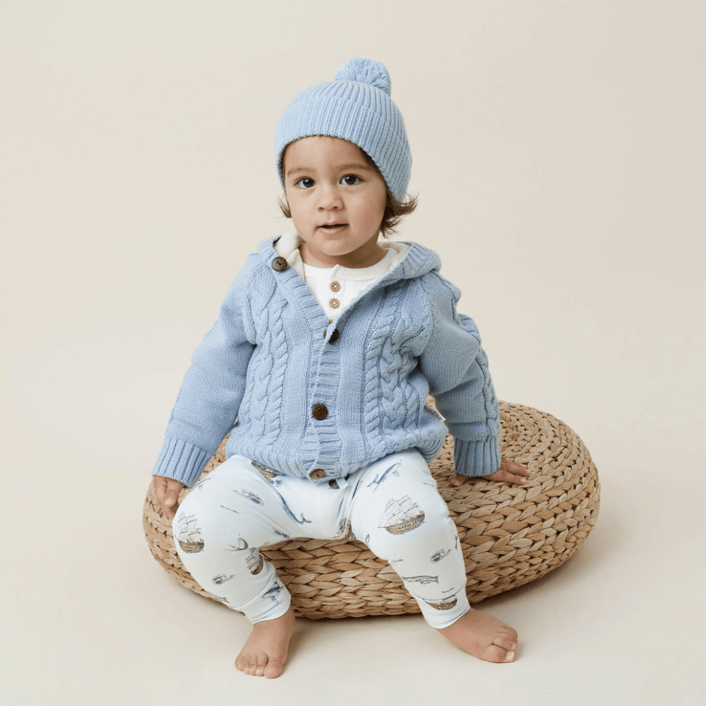 Cute-Child-Sitting-Wearing-Aster-and-Oak-Organic-Cable-Knit-Cardigan-Naked-Baby-Eco-Boutique