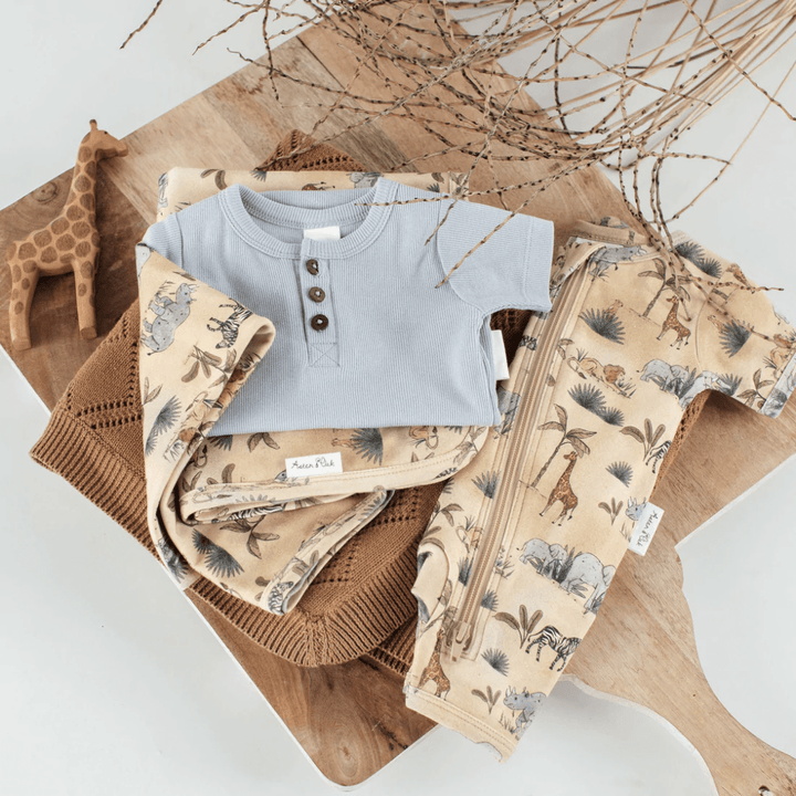Flatlay-Of-Aster-And-Oak-Organic-Cotton-Zip-Romper-Safari-Naked-Baby-Eco-Boutique