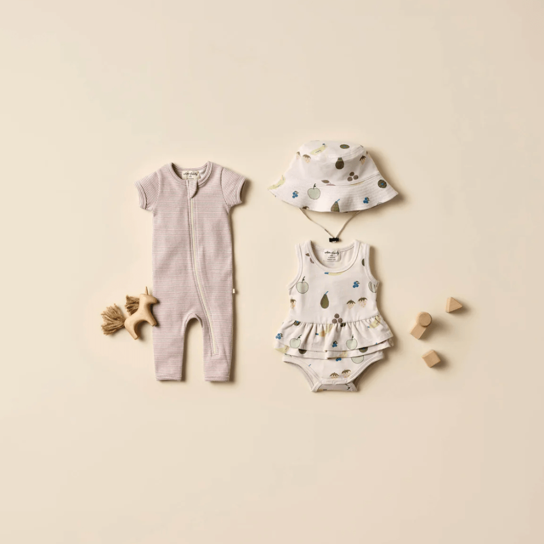 Flatlay-Featuring-Wilson-and-Frenchy-Organic-Ruffle-Onesie-Fruity-Naked-Baby-Eco-Boutique