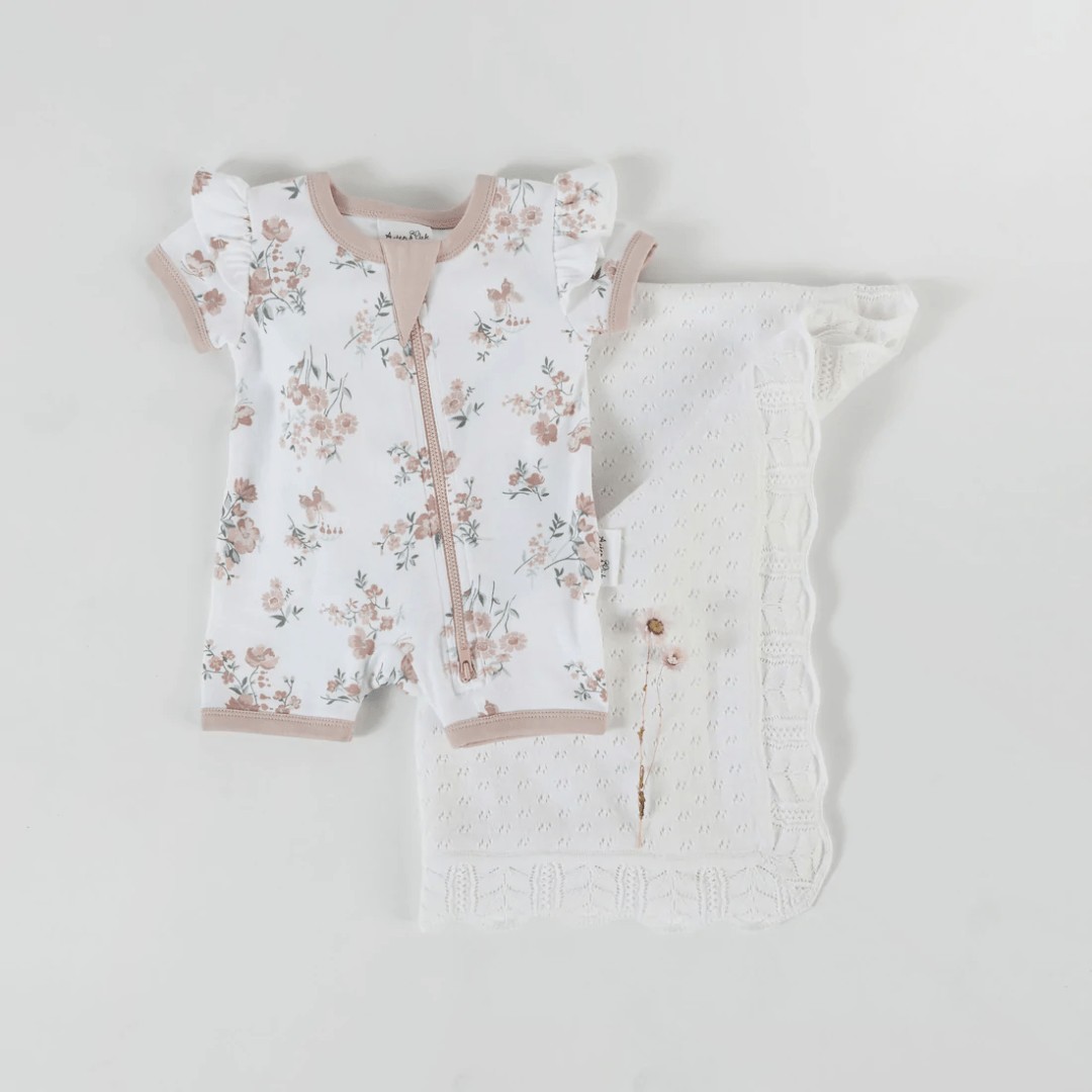 Flatlay-Of-Aster-And-Oak-Organic-Cotton-Flutter-Sleeve-Zip-Romper-Primrose-Naked-Baby-Eco-Boutique