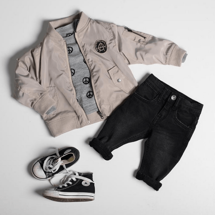 An Anarkid Bomber Jacket - LUCKY LAST - NAVY - 0-3 MONTHS outfit featuring jeans and sneakers.