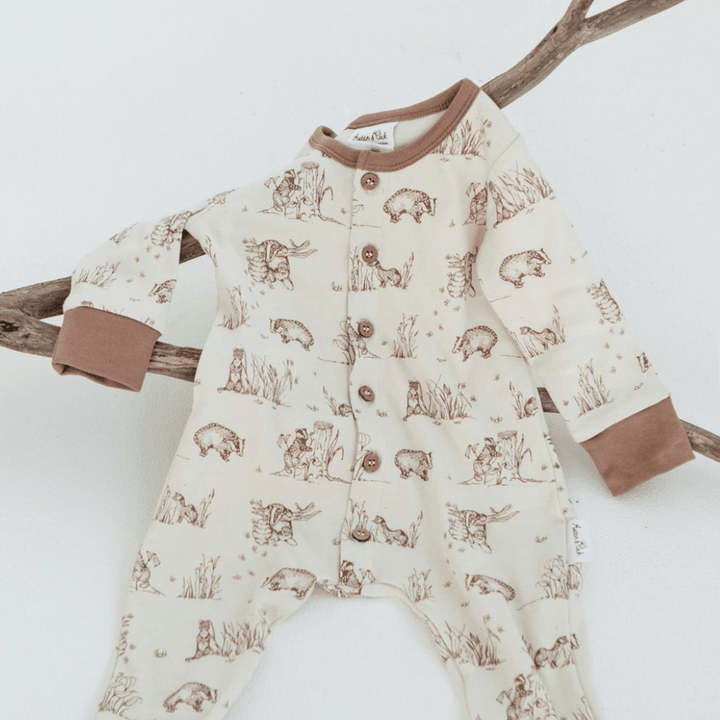 Flatlay-of-Aster-and-Oak-Organic-Cotton-Button-Romper-Badger-Naked-Baby-Eco-Boutique