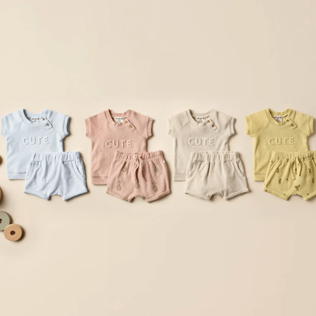 Flatlay-of-Tops-and-Shorts-with-Wilson-and-Frenchy-Organic-Terry-Slouch-Shorts-Naked-Baby-Eco-Boutique