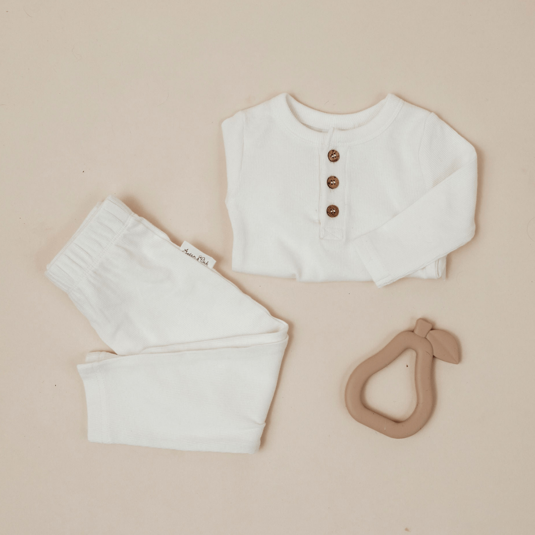 Flatlay-with-Aster-and-Oak-Organic-Rib-Onesie-Snow-Naked-Baby-Eco-Boutique