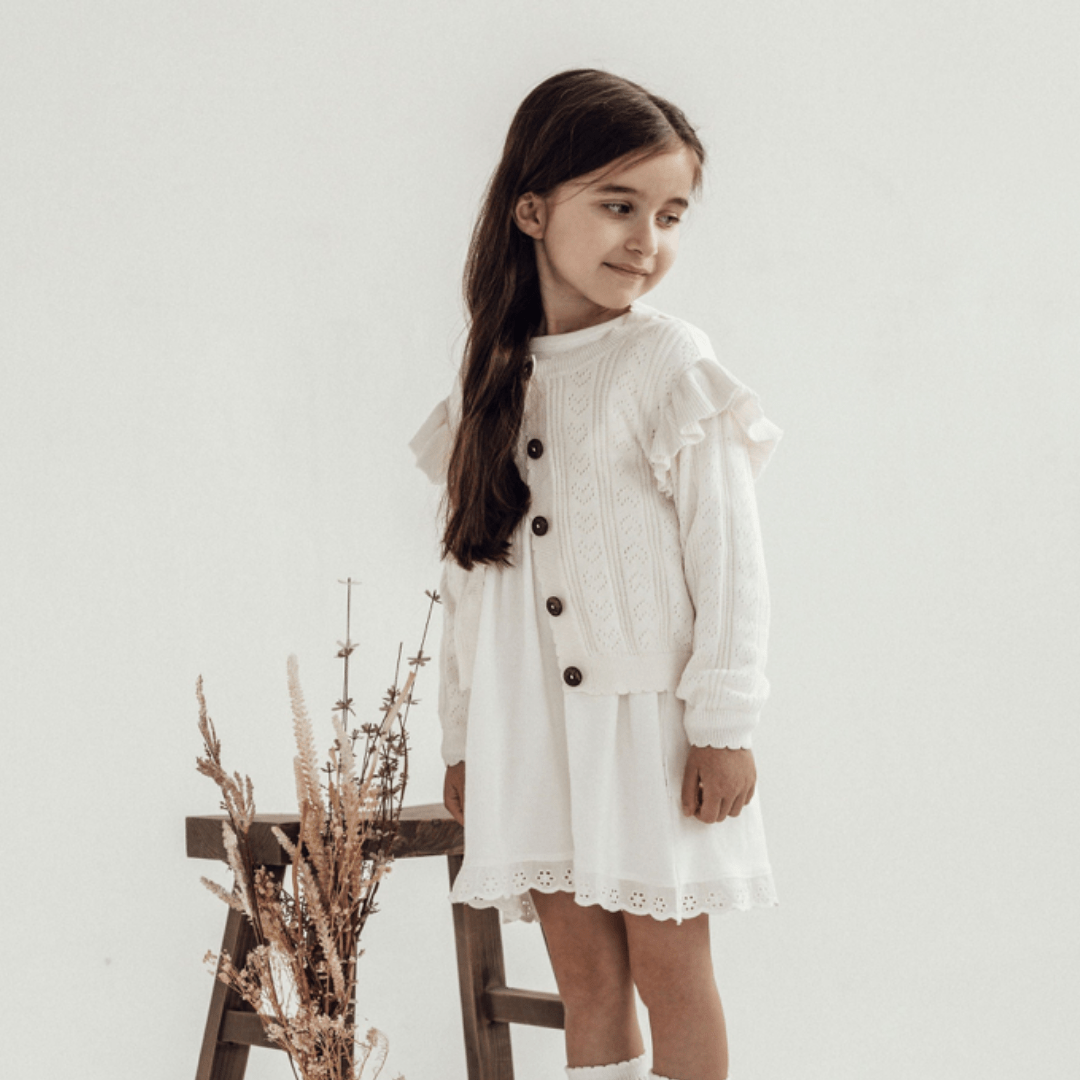 Girl-Wearing-Aster-And-Oak-Organic-Ruffle-Knit-Cardigan-Off-White-Naked-baby-Eco-Boutique