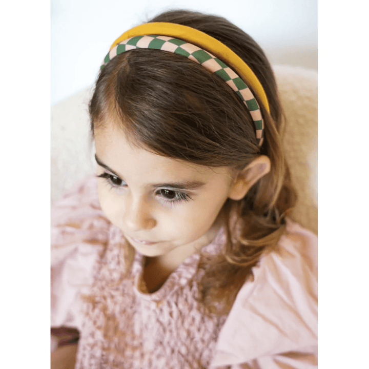 Girl-Wearing-Both-Headbands-Grech-And-Co-Organic-Cotton-Headbands-Two-Pack-Checks-Sunset-And-Orchard-Naked-Baby-Eco-Boutique