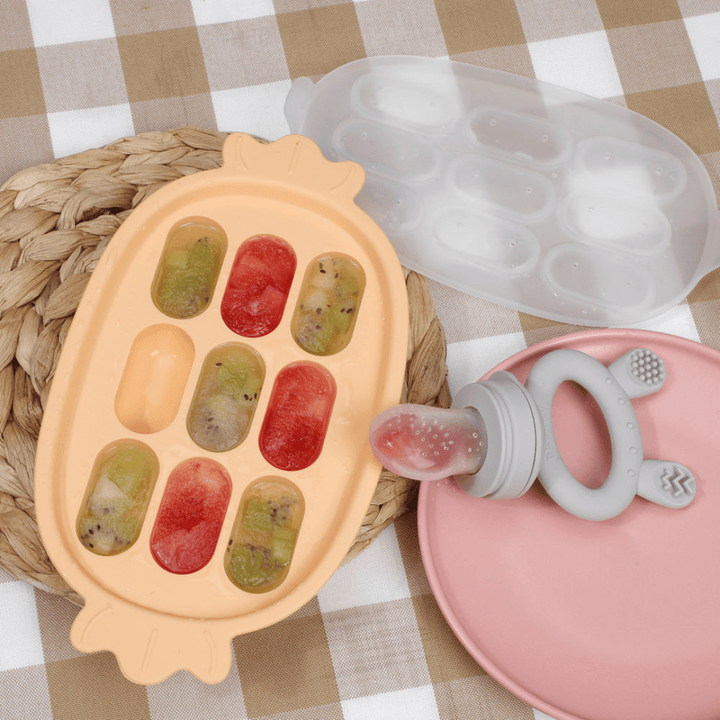 Haakaa-Silicone-Nibble-Tray-Apricot-Shown-with-Fresh-Food-Feeder-and-Teether-Naked-Baby-Eco-Boutique