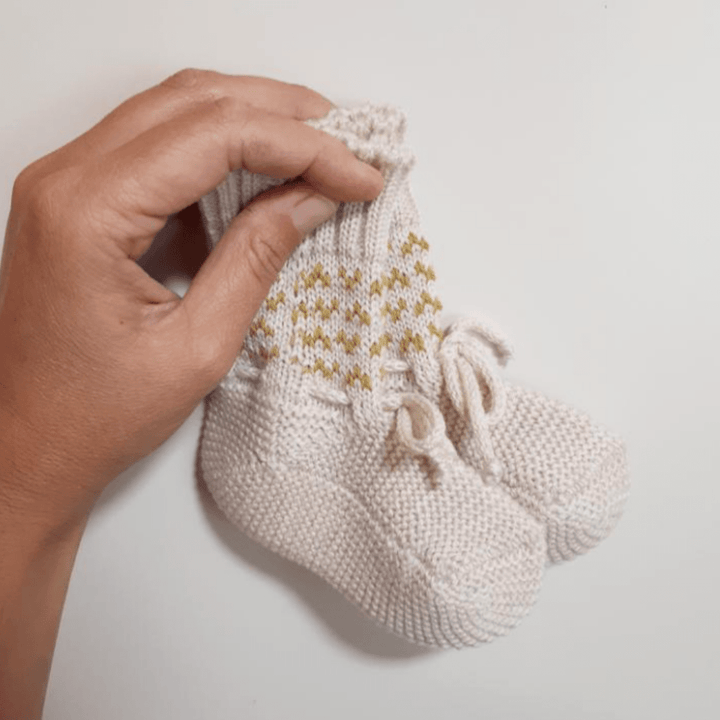 Hand-Holding-Lola-and-Me-Merino-Knit-Booties-Arrow-Naked-Baby-Eco-Boutique