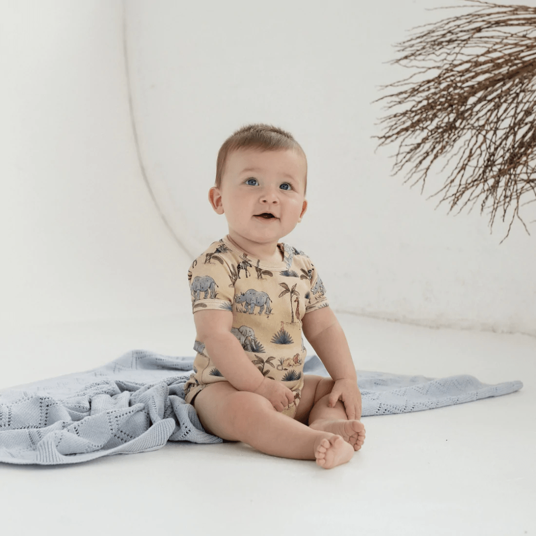 Happy-Boy-Wearing-Aster-And-Oak-Organic-Cotton-Onesie-Safari-Naked-Baby-Eco-Boutique