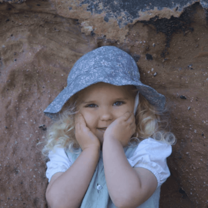 Happy-Girl-Wearing-Lola-And-Me-Linen-Sunhat-Floral-Violet-Naked-Baby-Eco-Boutique