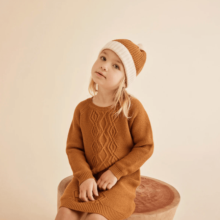Inquisitive-Girl-Wearing-Wilson-and-Frenchy-Knitted-Splice-Hat-Naked-Baby-Eco-Boutique