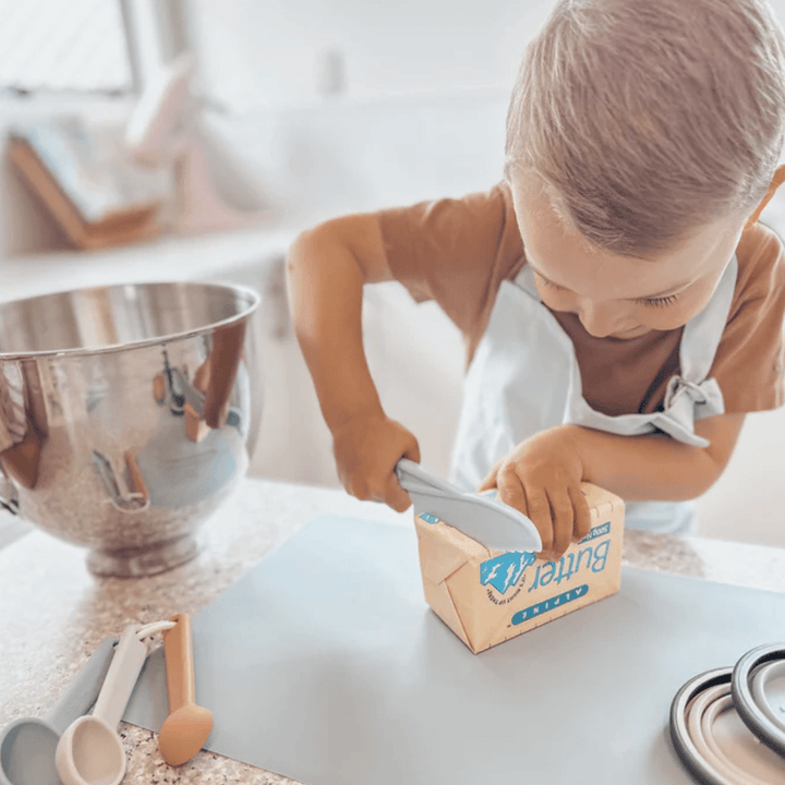 Little-Boy-Cutting-With-Petite-Eats-Kids-Safety-Knife-Blue-Naked-Baby-Eco-Boutique